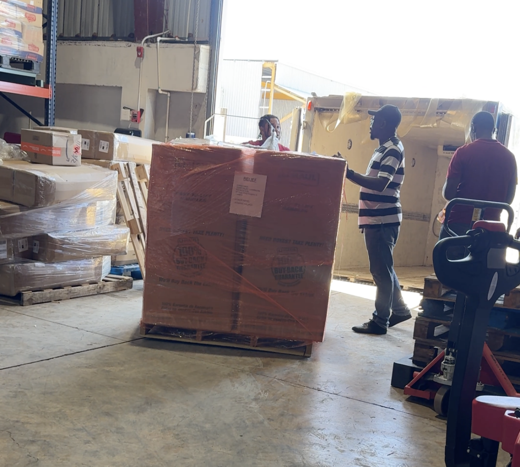Pallet of food and clothing in Burris Logistics warehouse prepared for international shipping.